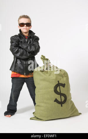 Young boy dressed as a bank robber Stock Photo