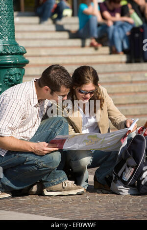 Couple looking at a map in Venice Italy