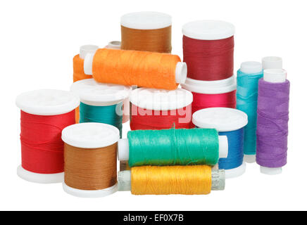 multicolored thread bobbins isolated on white background Stock Photo