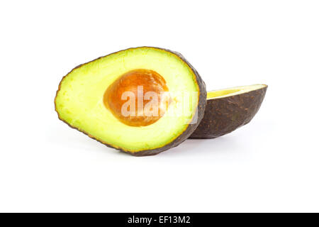 Two halves of avocados with smooth creamy flesh against a white background Stock Photo