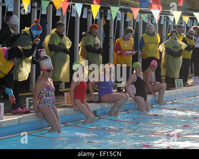 London, UK. 24th Jan, 2015. Competitors getting into water that was only 3.5¼C before starting to race. Races were the width of the Lido - 30 metres. Credit:  Susanne Masters/Alamy Live News Stock Photo