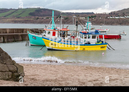Two fishing boats moored in Newquay Harbour in Ceredigion on the West Coast of Wales.  Newquay is a small fishing village. Stock Photo