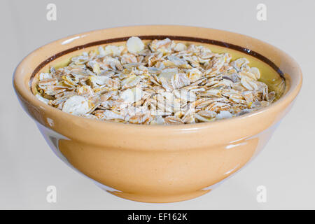 oatmeal in a clay bowl breakfast cereals carbohydrates Stock Photo