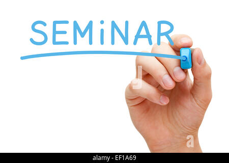 Hand writing Seminar with blue marker on transparent wipe board isolated on white. Stock Photo