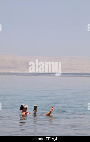 Relaxing in the dead sea. Stock Photo