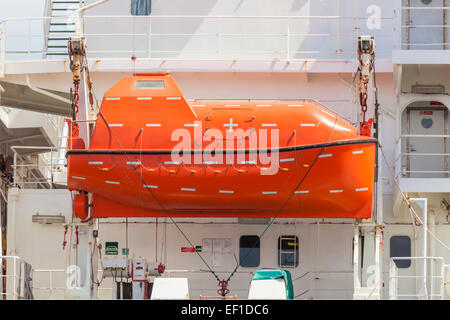 Totally enclosed lifeboat on a cargo ship Stock Photo