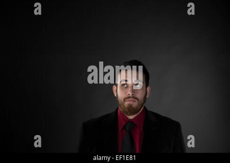 Goatee Man in Formal Wear Looking Up Stock Photo