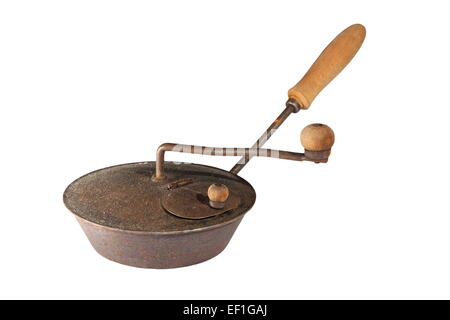 ancient coffee or chestnut  roaster isolated over white Stock Photo