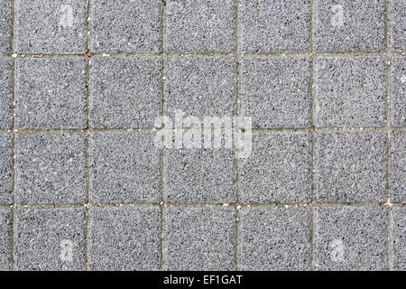grey asphalt tiles texture on urban pedestrian path Stock Photo