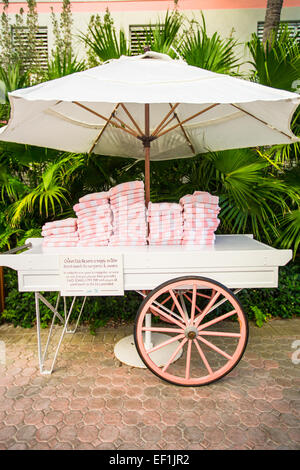 Pile of bath towels near swimming pool at exotic resort Stock Photo