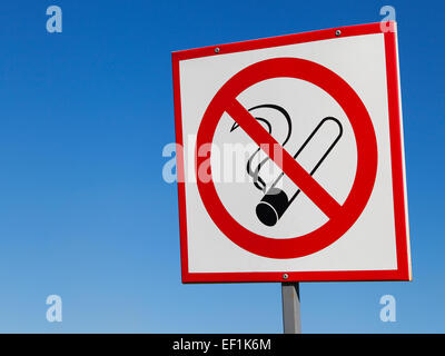 No smoking sign on blue sky background Stock Photo