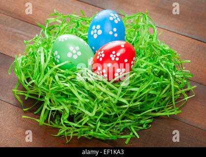 easter eggs in straw nest Stock Photo