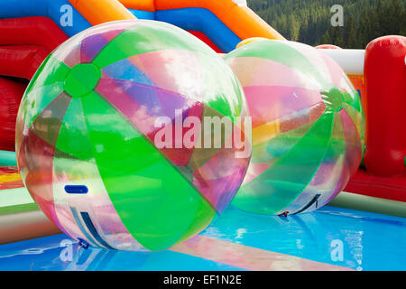 water walking ball, zorbing in open swimming pool Stock Photo