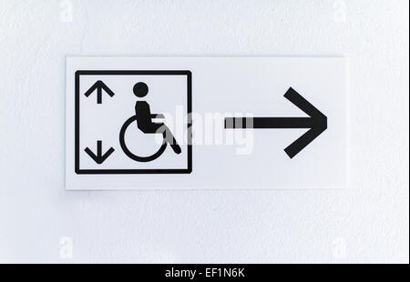 Arrow shows lift for disabled people. Stock Photo