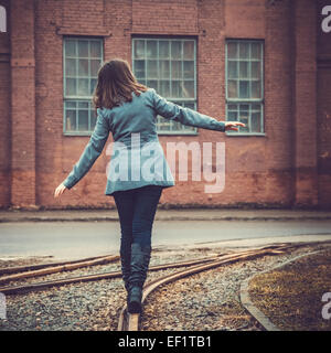 girl walking on the railway Stock Photo