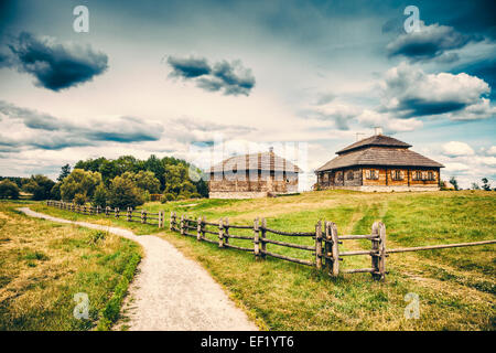 Beautiful ethno house on rural lanscape Stock Photo