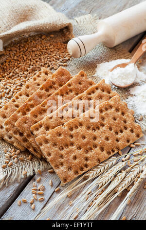 grain rye Crispbread, cereal crackers on wooden rustic table Stock Photo