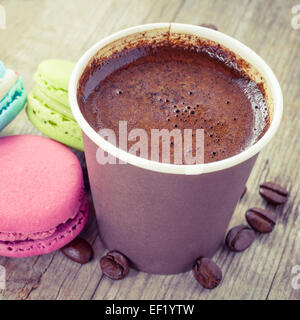 macaroons and espresso coffee  on old wooden rustic table, vintage stylized Stock Photo