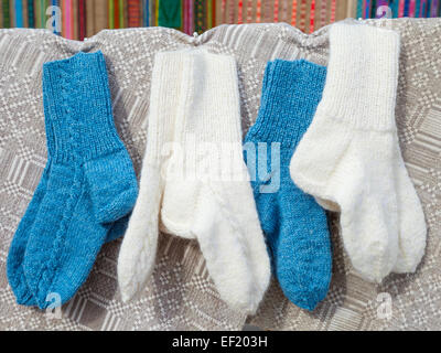 wool socks hanging on simple cloth Stock Photo
