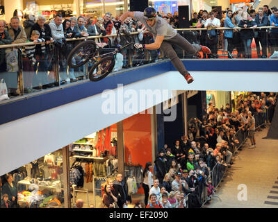 Berlin, Germany. 24th Jan, 2015. Czech freestyler Tomas Zejda shows off spectacular jumps with his BMX bike between the ground floor and upper level at the EASTGATE Shopping Center in the district of Marzahn in Berlin, Germany, 24 January 2015. 30 international bikers and 8 freestylers showed off their acrobatic talent at the event. Photo: Thomas Uhlemann/dpa - NO WIRE SERVICE -/dpa/Alamy Live News Stock Photo