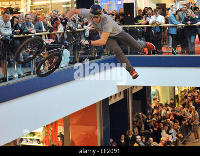 Berlin, Germany. 24th Jan, 2015. Czech freestyler Tomas Zejda shows off spectacular jumps with his BMX bike between the ground floor and upper level at the EASTGATE Shopping Center in the district of Marzahn in Berlin, Germany, 24 January 2015. 30 international bikers and 8 freestylers showed off their acrobatic talent at the event. Photo: Thomas Uhlemann/dpa - NO WIRE SERVICE -/dpa/Alamy Live News Stock Photo