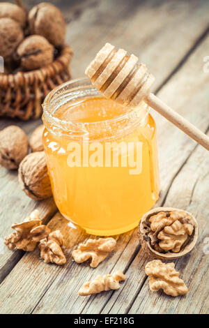 Honey in a glass jar with nuts and fruits for sell for tourist in Montenegro  food market, close up Stock Photo - Alamy