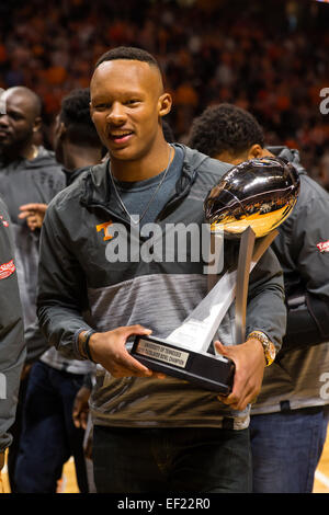 January 24, 2015: Tennessee Volunteers football quarterback Josh Dobbs and teammates show off the TaxSlayer Bowl Trophy during the NCAA basketball game between the University of Tennessee Volunteers and the Texas A&M Aggies at Thompson Boling Arena in Knoxville TN Stock Photo