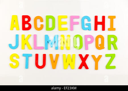 Colorful alphabet magnets on a whiteboard Stock Photo