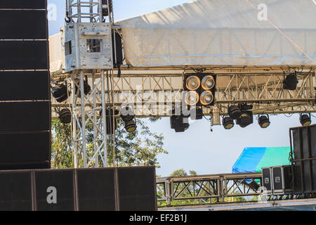 multiple spotlights on a theatre stage lighting rig for consert Stock Photo