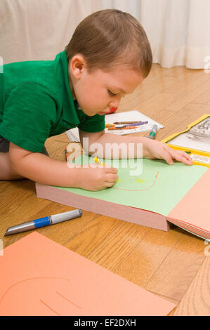 Young boy drawing a picture Stock Photo