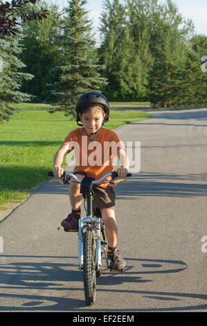Boy at the park with a bicycle
