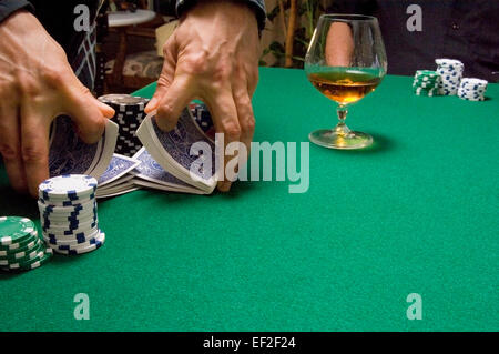 Hands shuffling a deck of cards Stock Photo