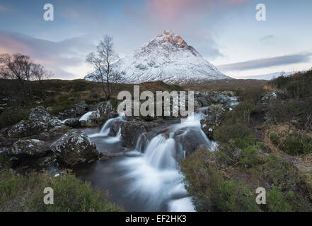 Snow dusted Stob Dearg, Buachaille Etive Mor, and waterfalls on the River Coupall, Glencoe, Scotland Stock Photo