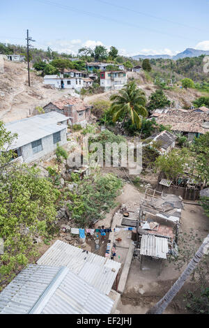Cuban poverty lifestyle and landscape: typical dilapidated houses, homesteads and shacks in a run-down poor village near Trinidad, Cuba Stock Photo
