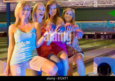 Group of girl friends bowling Stock Photo