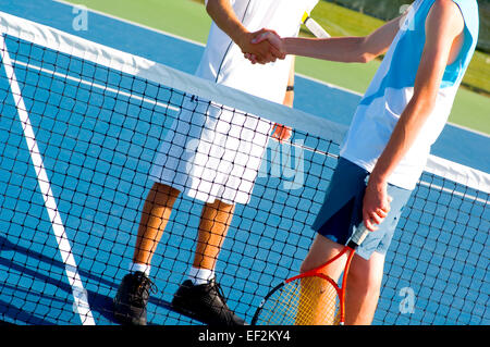 Tennis players shaking hands Stock Photo