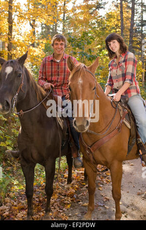 Couple going horseback riding Stock Photo