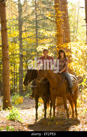 Couple going horseback riding Stock Photo