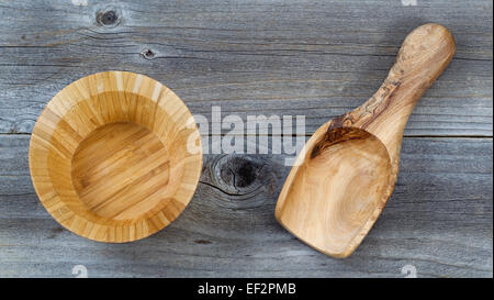 Top view angled shot of an empty wooden bowl and scoop on rustic wood Stock Photo