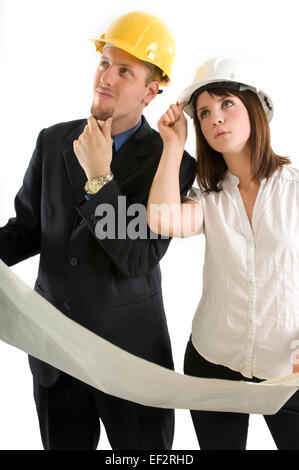 Two architects looking at blueprints Stock Photo