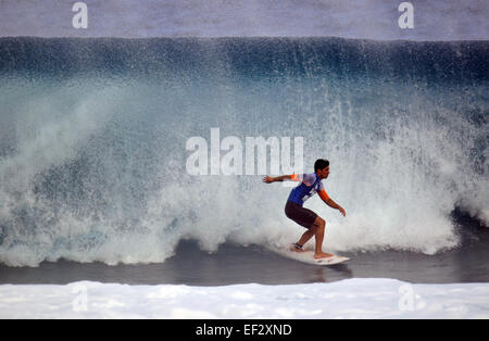 Brazilian pro-surfer, Gabriel Medina, exits a tube at the 2014 Pipemasters, Banzai Pipeline, Ehukai Beach Park, North Shore Oahu Stock Photo