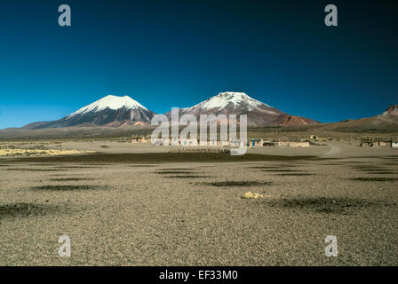 Scenic view of bolivian volcanoes,Pomerape and Paranicota in Sajama national park Stock Photo