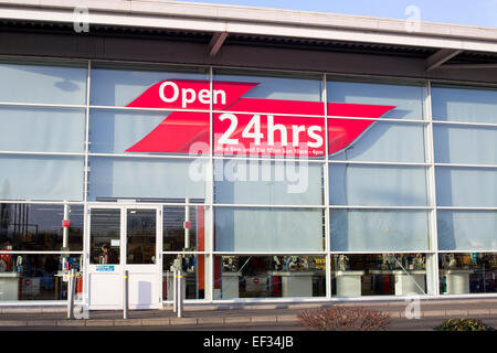 Tesco Extra Supermarket open 24 hours sign Stock Photo