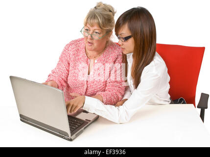 Student helping teacher with laptop Stock Photo