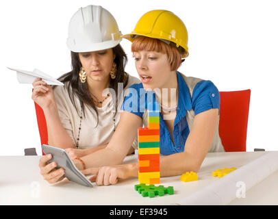 Two women looking at a calculator Stock Photo