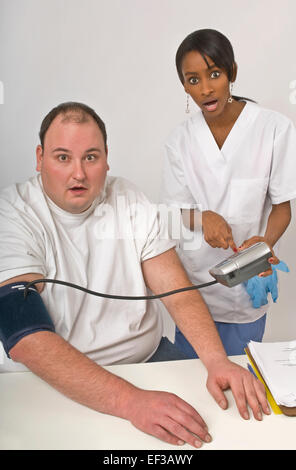 Nurse checking overweight man's blood pressure Stock Photo