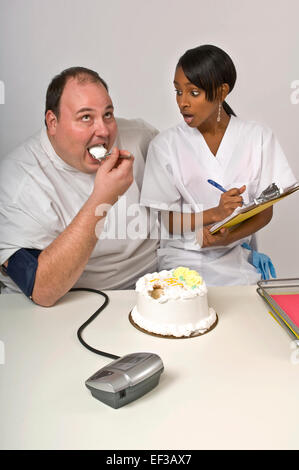 Nurse unhappy with overweight man eating cake Stock Photo