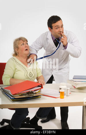 Doctor smoking while performing patient examination Stock Photo