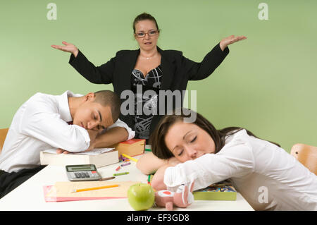 Students sleeping at desk Stock Photo