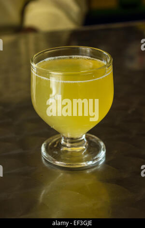 A glass of Poncha stands on a table on the island of Madeira, Portugal. Stock Photo